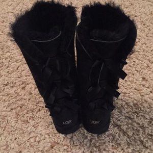 Black tall ugg boots with bows